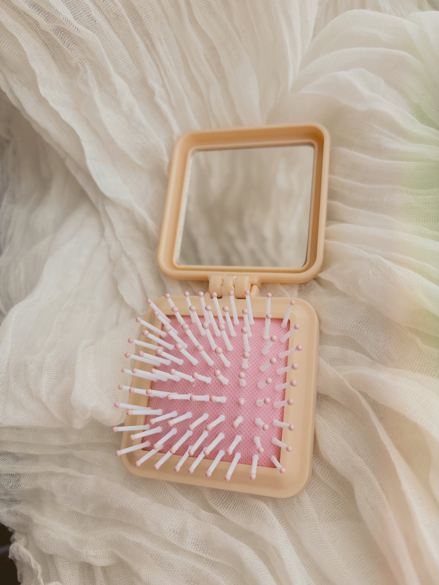 Pocket mirror and brush