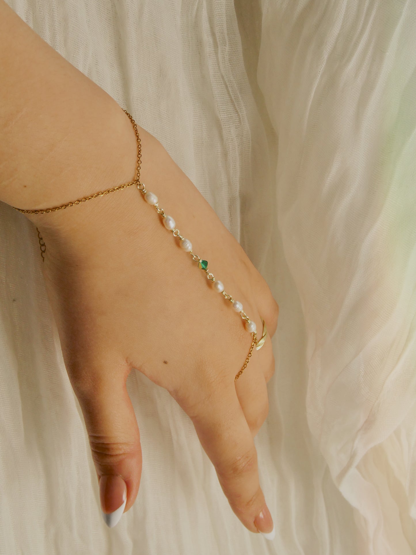 Custom pearl and gem hand chain