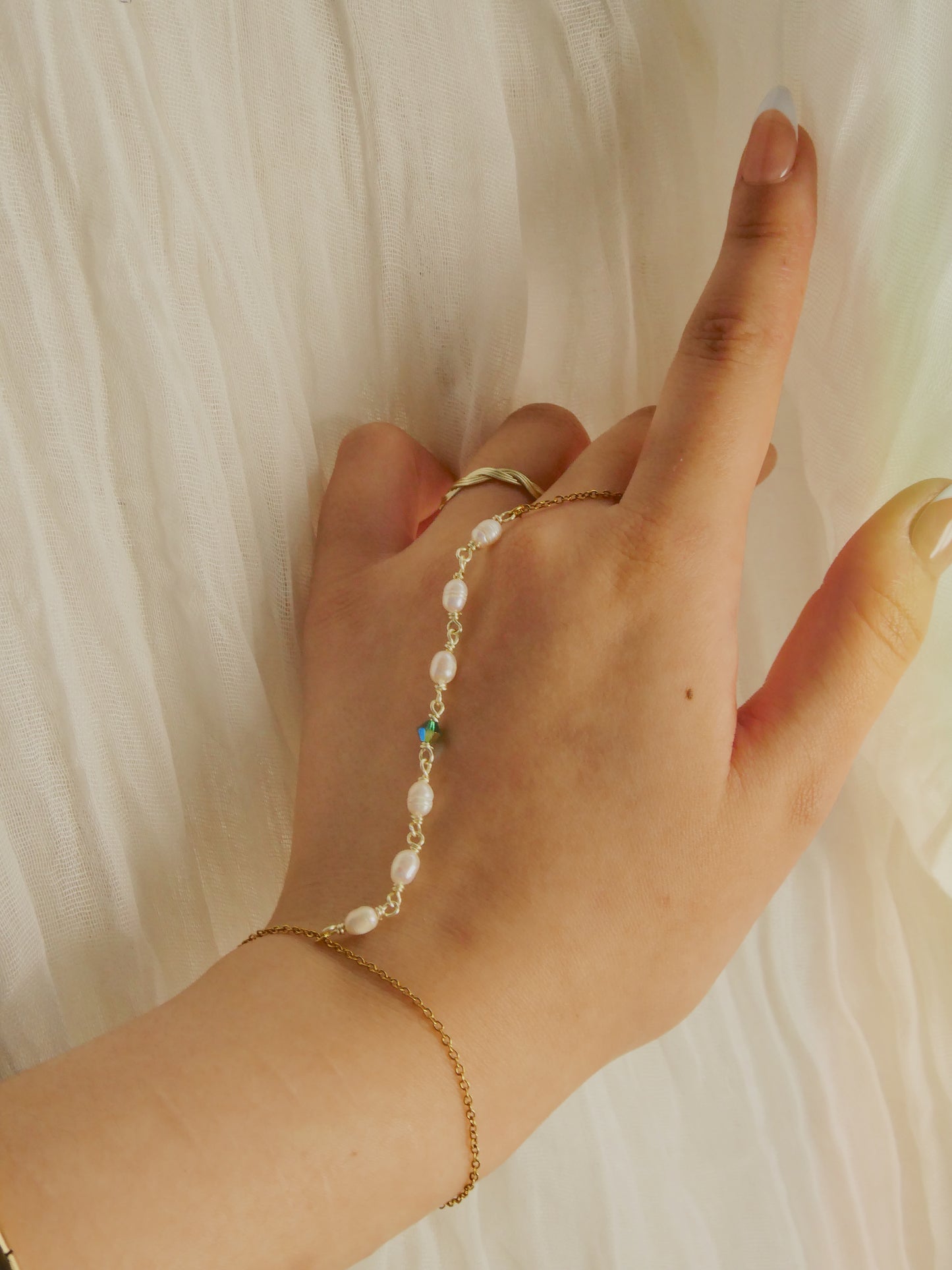 Custom pearl and gem hand chain