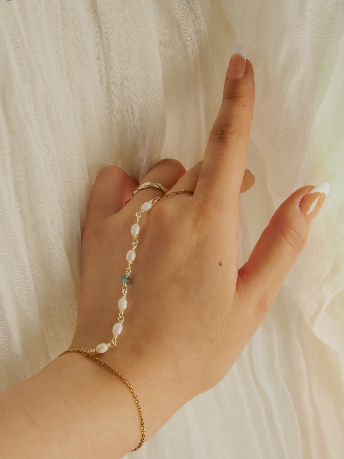 Custom pearl and gem hand chain
