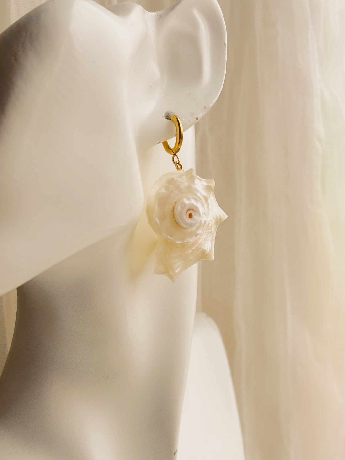 Large white spiral shell earrings
