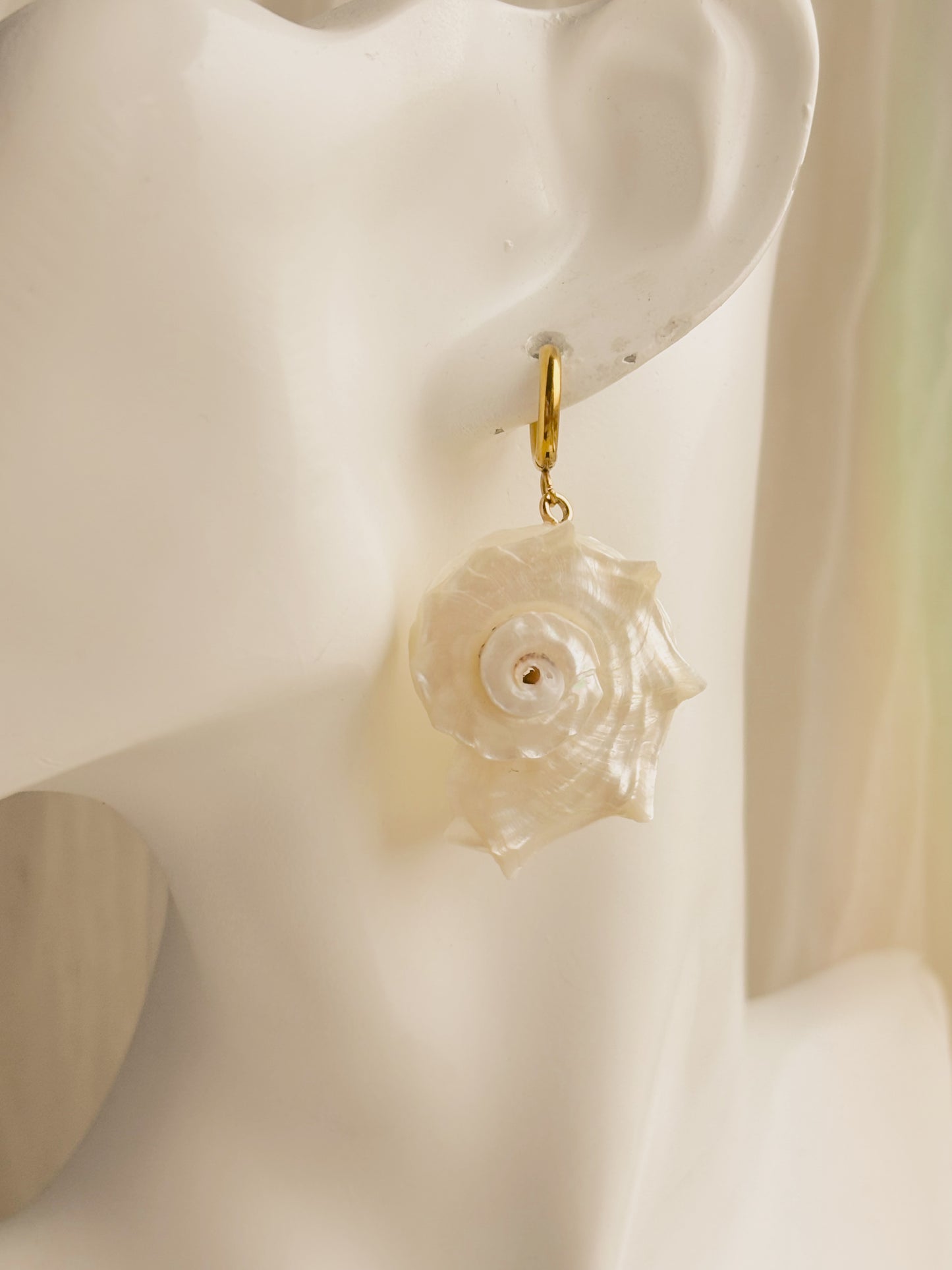 Large white spiral shell earrings