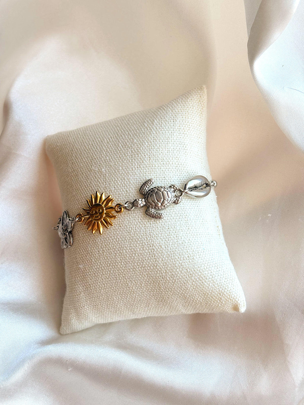 Mixed metal coastal charm bracelet