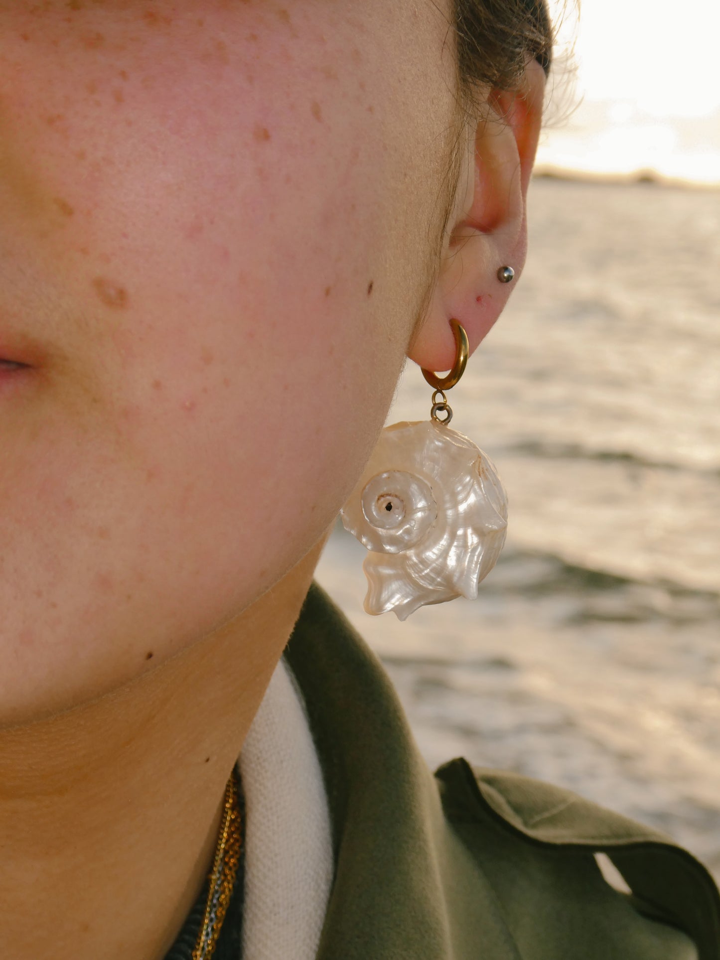 Large white spiral shell earrings