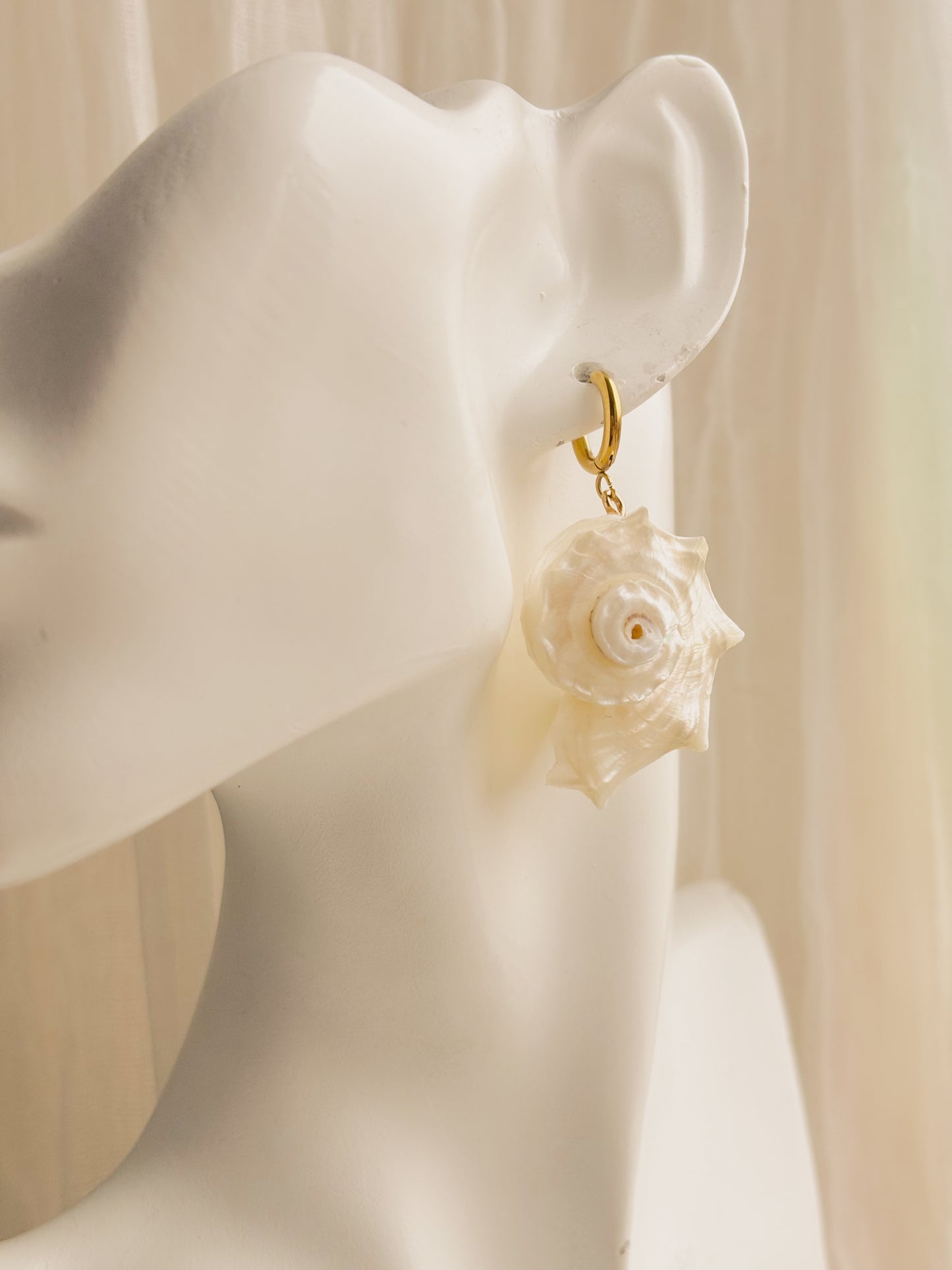 Large white spiral shell earrings