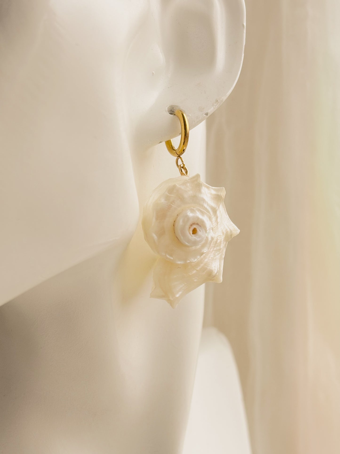Large white spiral shell earrings