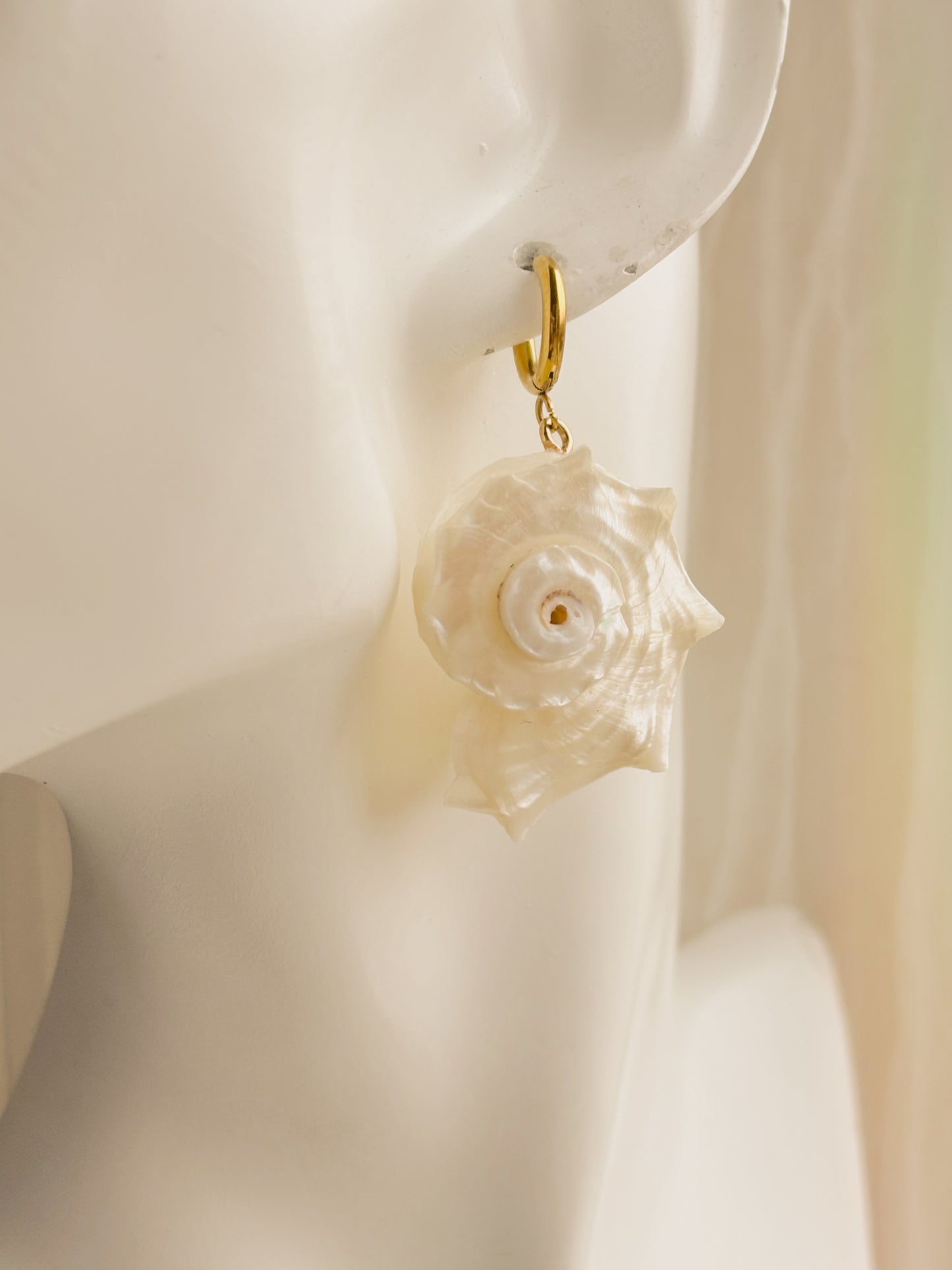 Large white spiral shell earrings