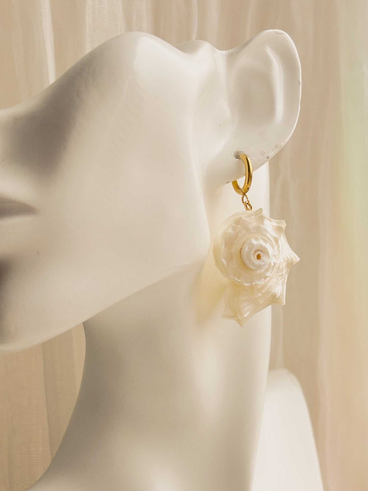 Large white spiral shell earrings